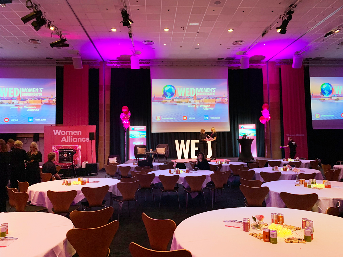 Women's Entrepeneurship Day. LightScape on Stage Scene UltraLight behind the Dj booth